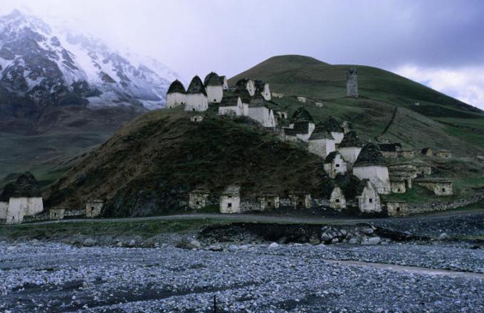 Dargavs in the city of the dead near Vladikavnas. The 44 beehive shaped tombs, some resembling boats, have been mostly restored and some still hold human remains in various stages of decay.